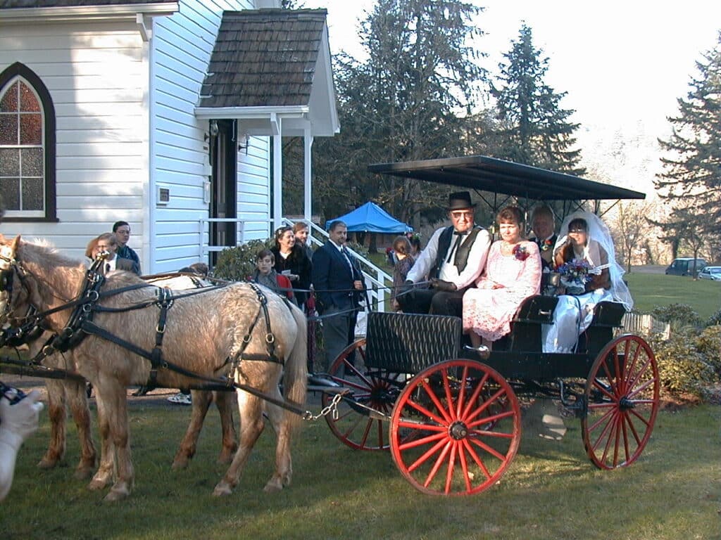 Horse drawn buggy in front of the Baker Cabin Church