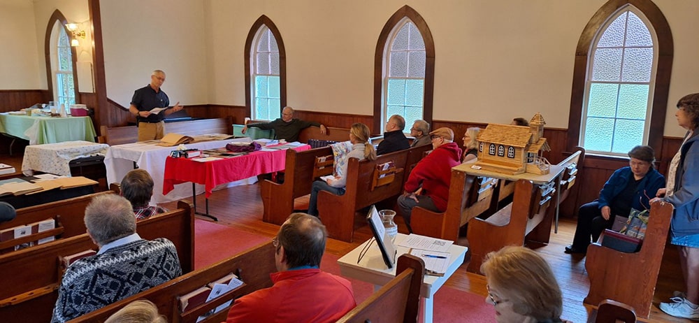 Church meeting at the Baker Cabin